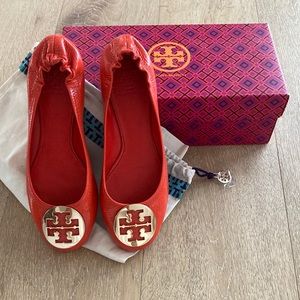 Bright orange leather Tory Burch